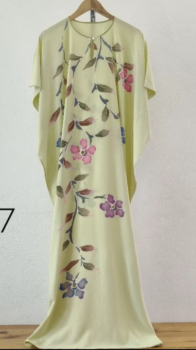 Lime green hand-drawn batik kaftan with pink and blue floral vine motifs