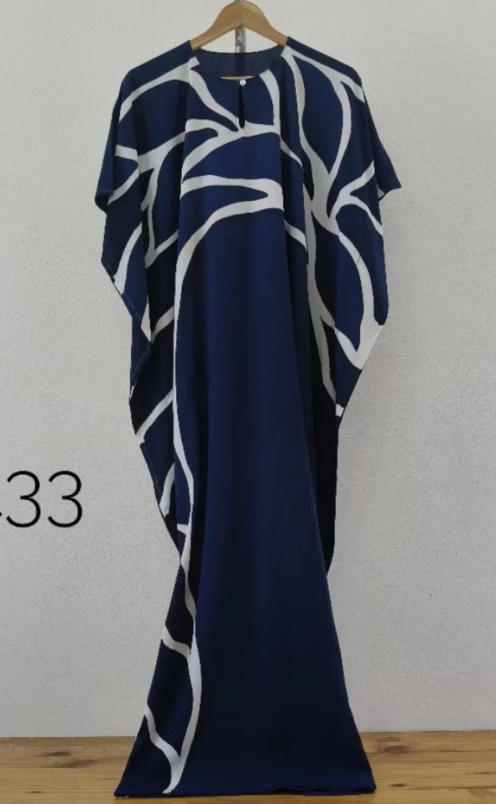 Navy kaftan with bold ivory organic lines